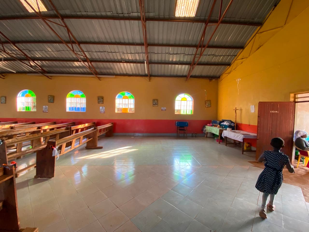The nave viewed from the side, with the congregation gathered near the entrance.